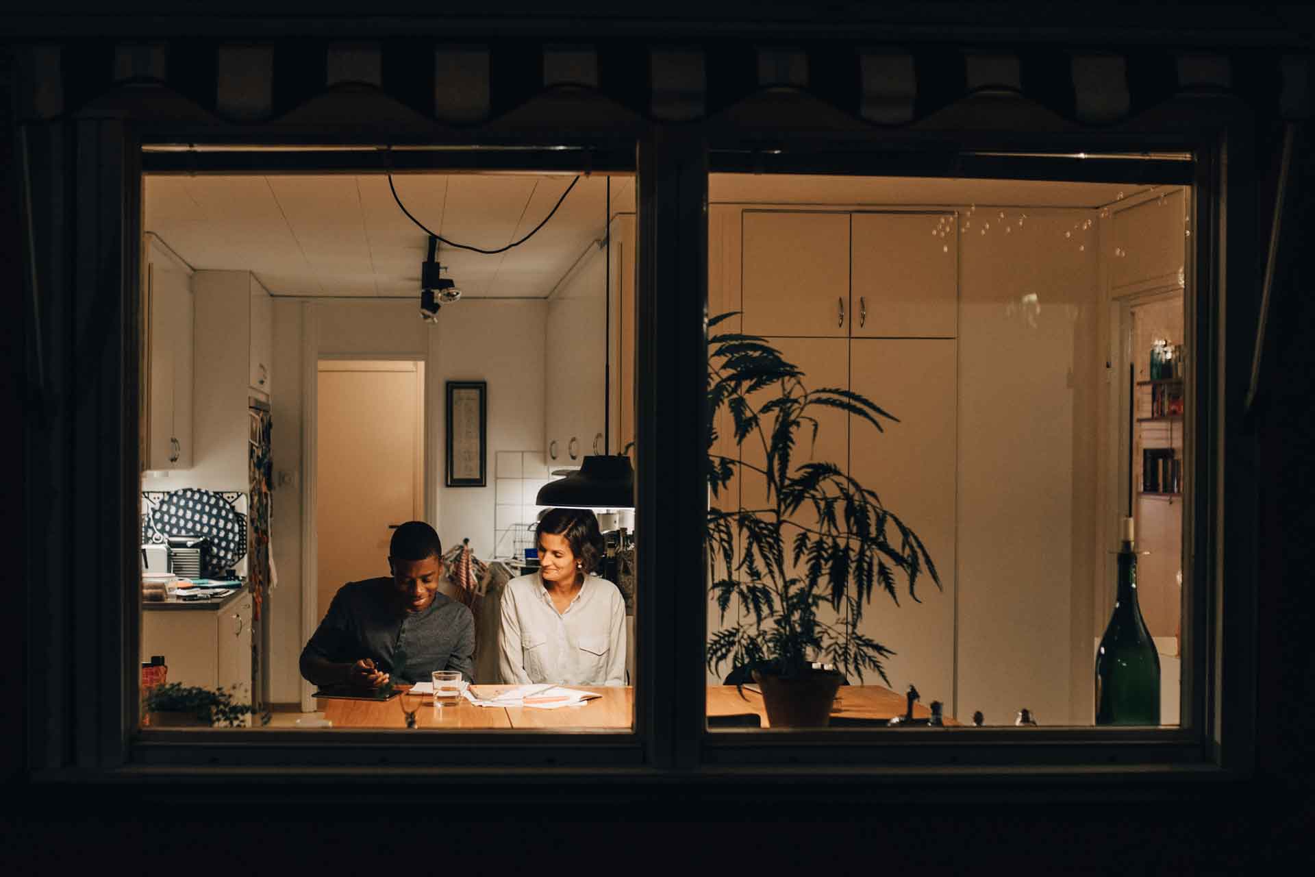 Two freelancers working on a project together at home